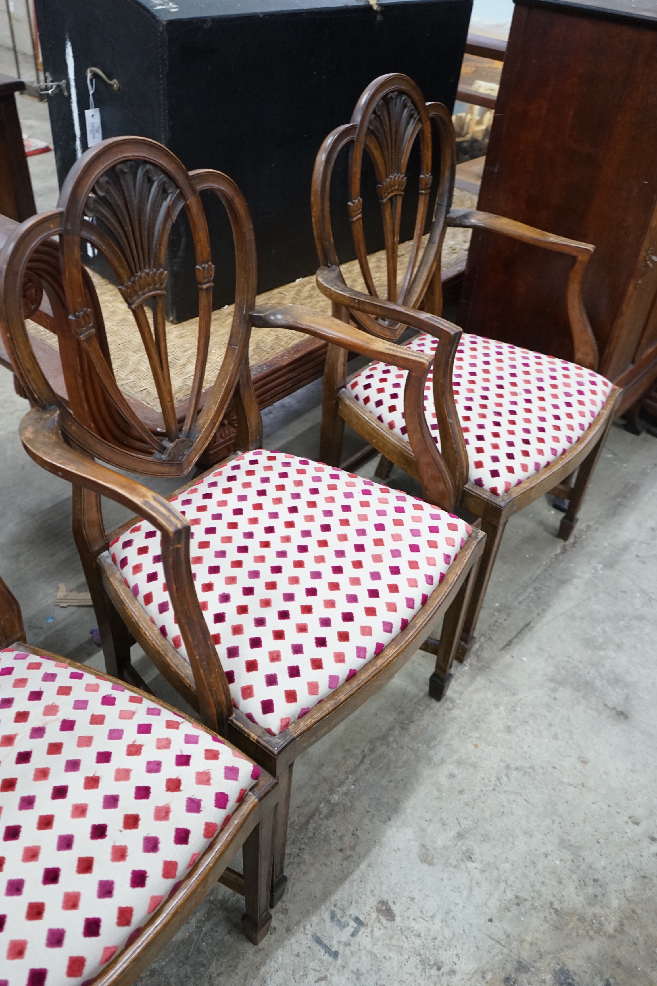A set of eight Hepplewhite style mahogany dining chairs, two with arms